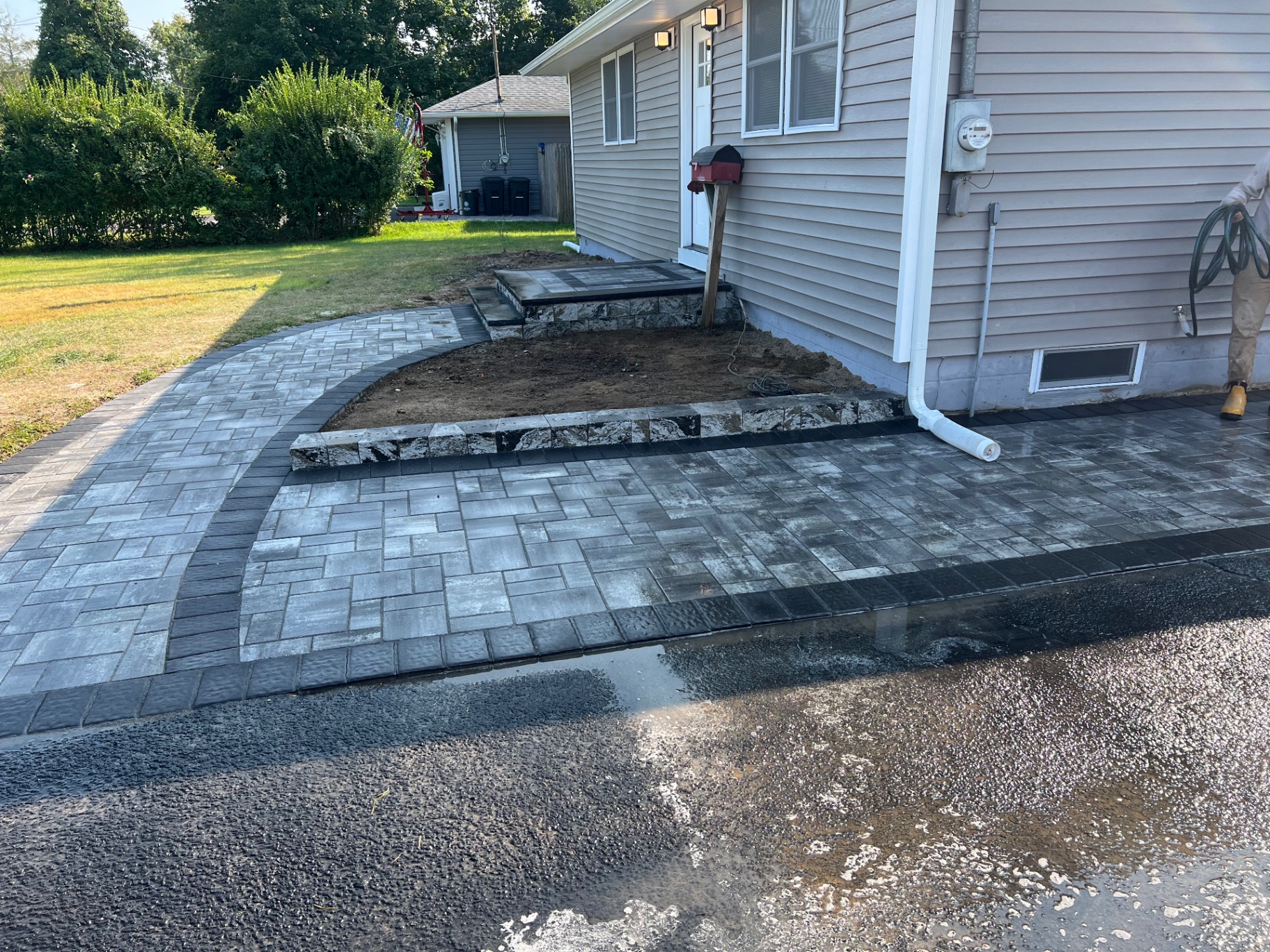 Finished curved paver walkway and front approach