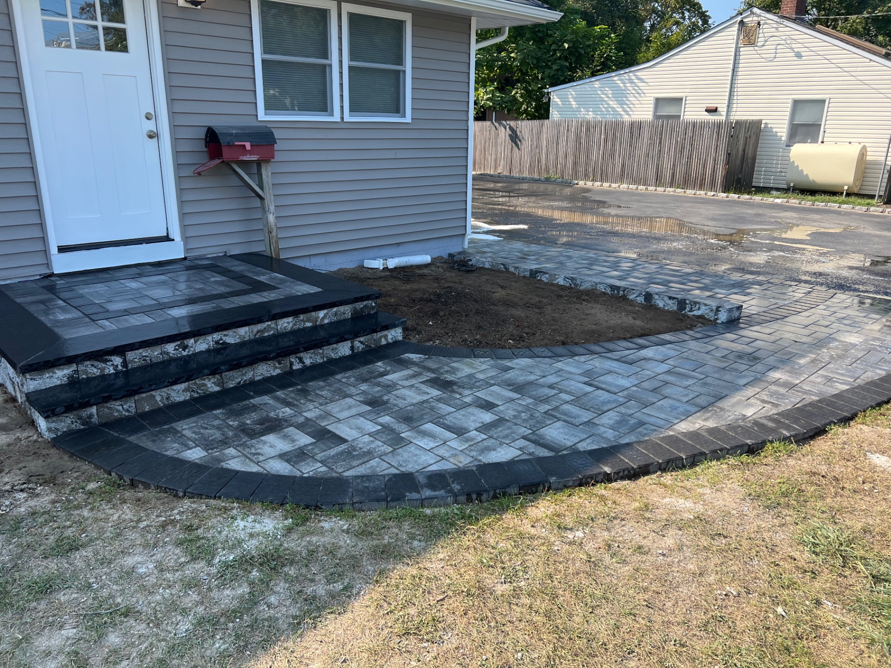 Finished front entry with new paver steps and walkway