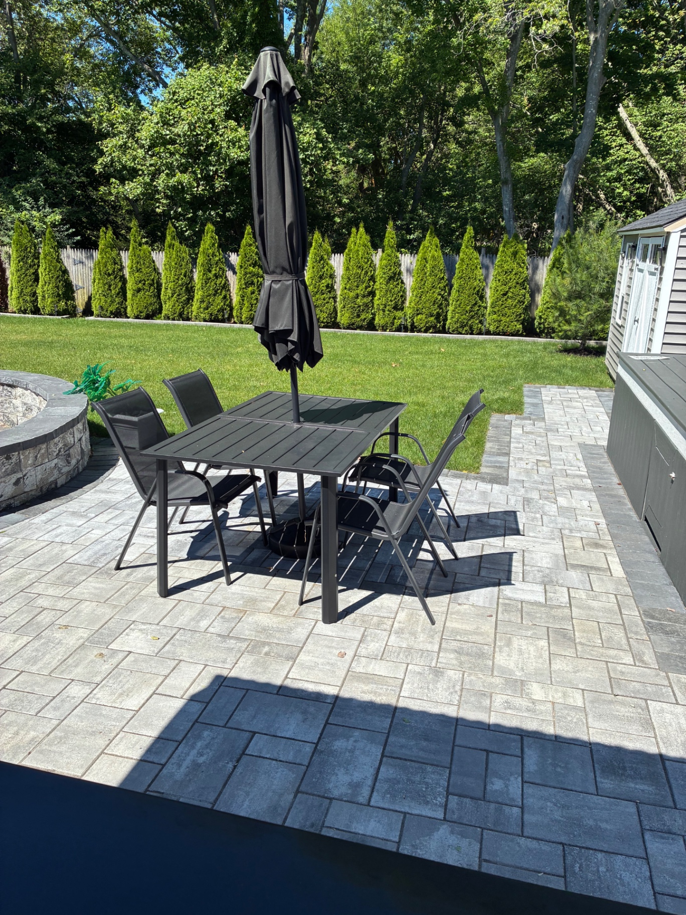 Finished paver patio with outdoor dining set